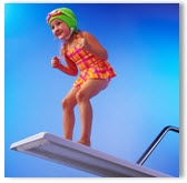Little Girl Preparing to Dive Off Diving Board